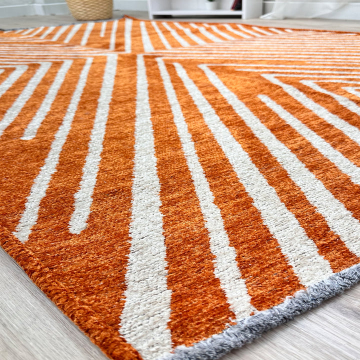 Tapis tissé lavable géométrique orange brûlé et crème