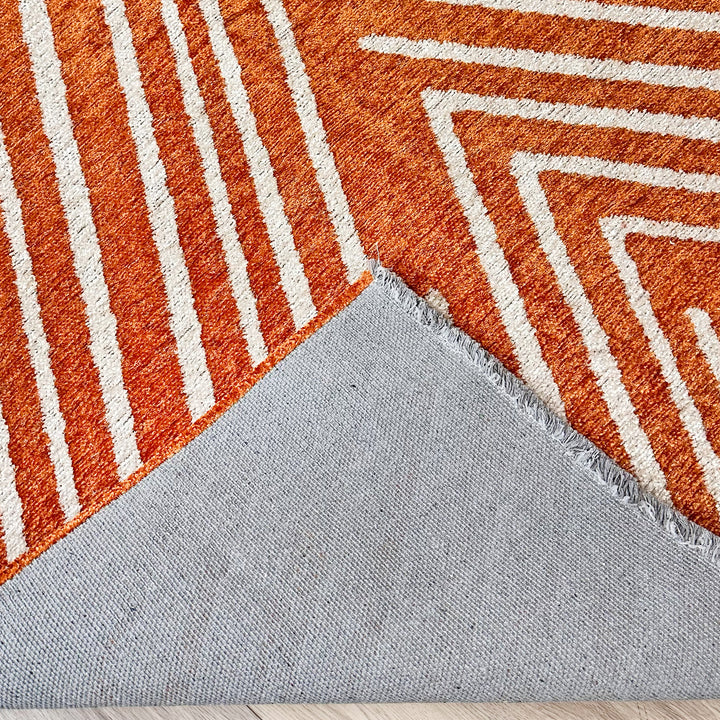 Tapis tissé lavable géométrique orange brûlé et crème